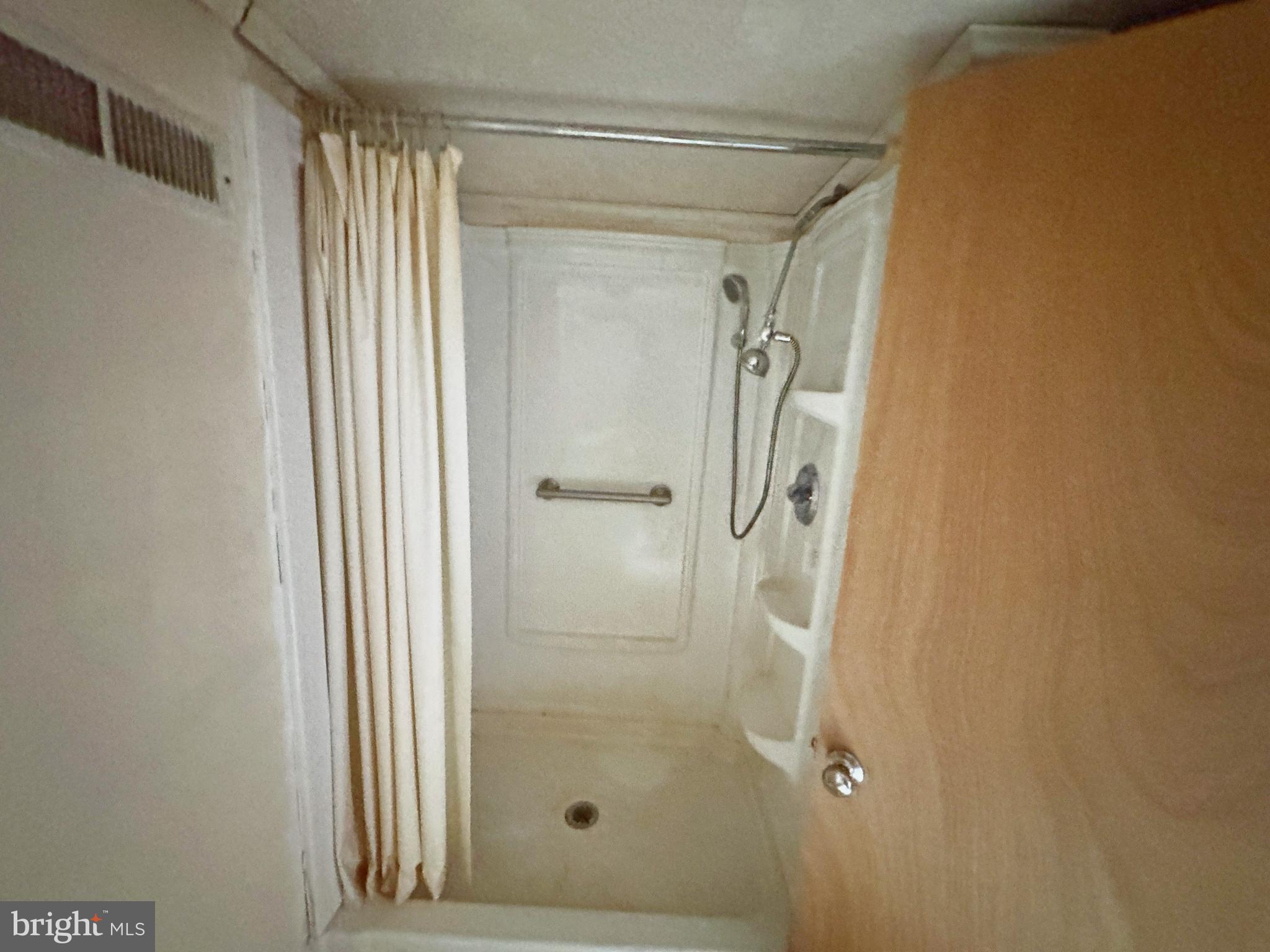 7130 Parsonsburg Road Parsonsburg, MD 21849 - Photo 10 of 10 a bathroom with a glass shower door