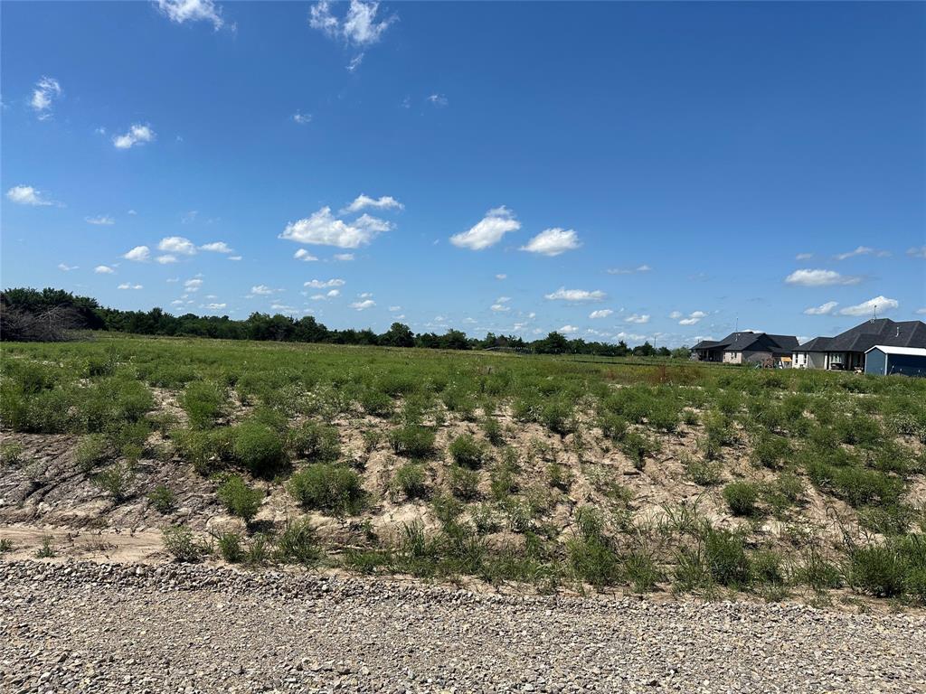 Lot 17 Co Road Farmersville, TX 75442 - Photo 5 of 7 Expansive lot featuring a gravel foreground, gently sloped terrain, and distant residential structures