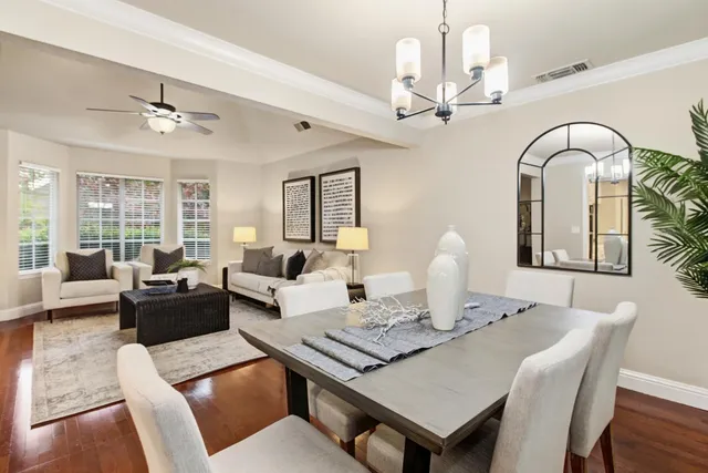 a living room with furniture a chandelier and a chandelier