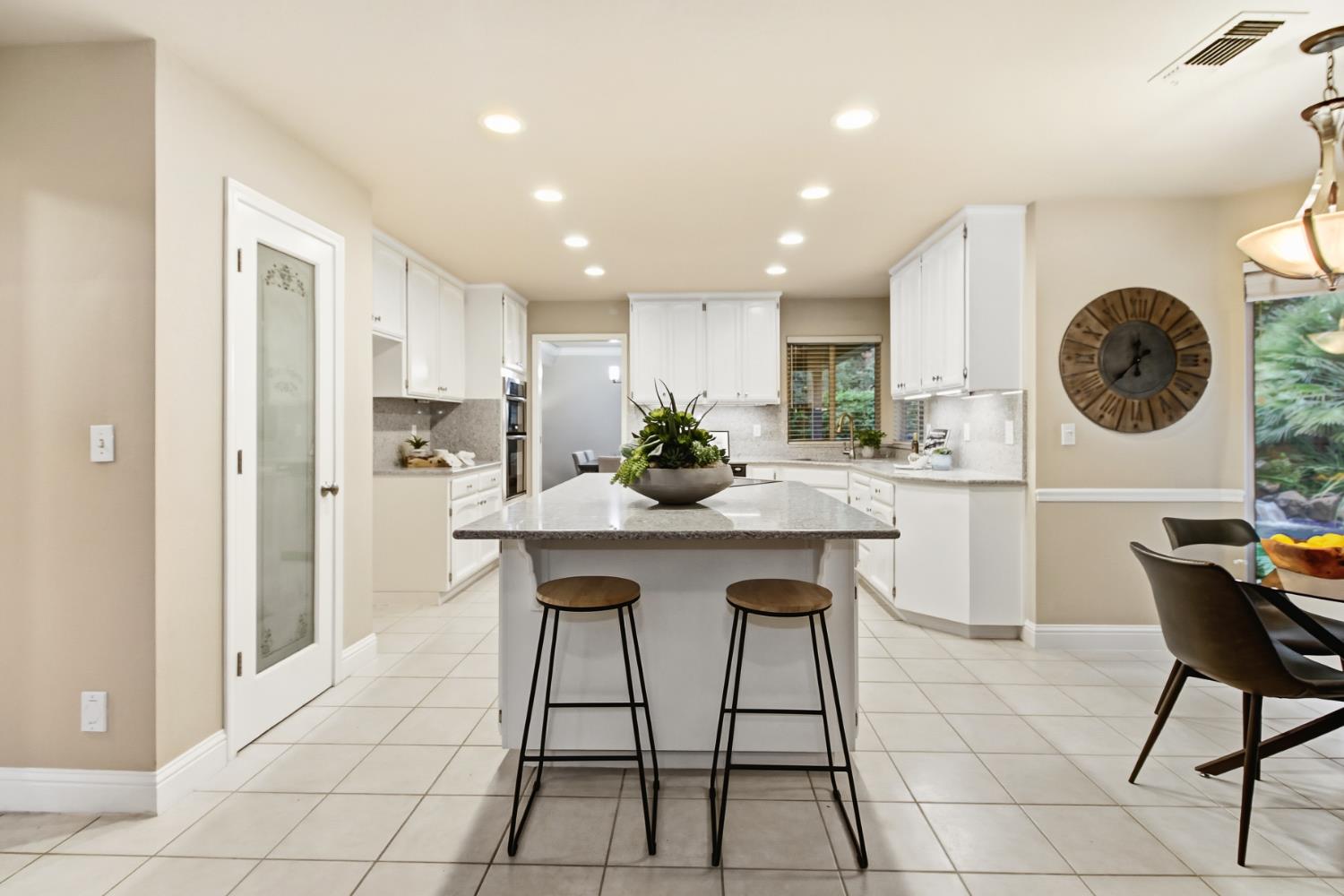 2760 Prestwick Drive Roseville, CA 95661 - Photo 18 of 45 a kitchen with a table and chairs