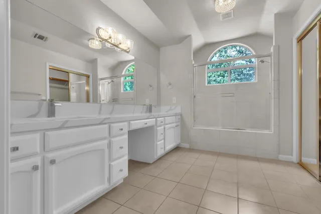 a bathroom with a sink a vanity and a mirror