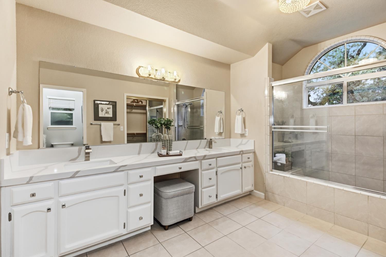 2760 Prestwick Drive Roseville, CA 95661 - Photo 29 of 45 a spacious bathroom with a granite countertop sink mirror and bathtub