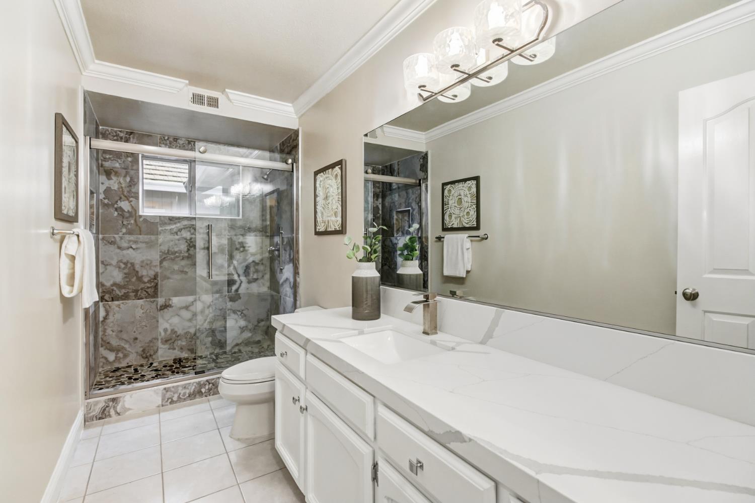 2760 Prestwick Drive Roseville, CA 95661 - Photo 35 of 45 a bathroom with a sink a toilet and shower