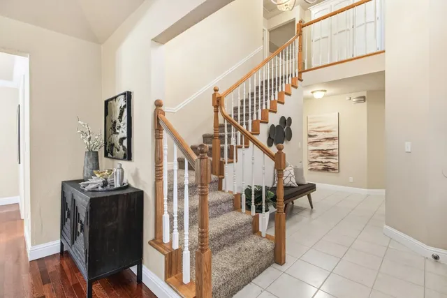 a view of entryway and hall with wooden floor