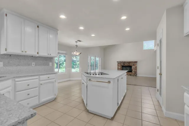 a kitchen with white cabinets