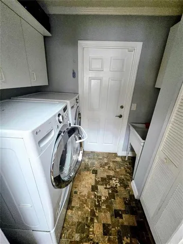 a view of a swimming pool with a patio