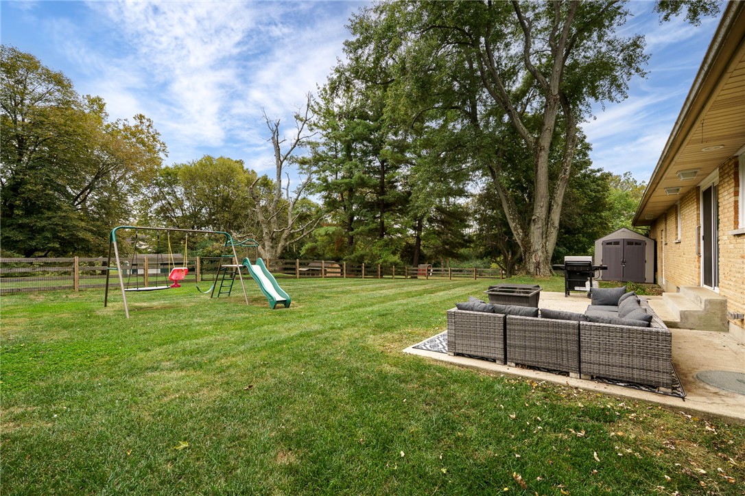 6950 Red Lion 5 Points Road Springboro, OH 45066 - Photo 54 of 78 This spacious backyard offers a perfect setting for outdoor enjoyment and relaxation.