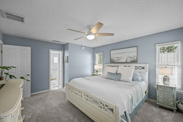 a en suite bathroom with double sink and a mirror