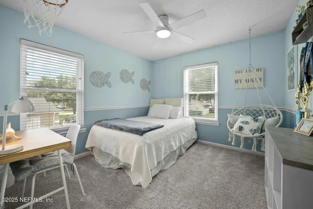 a view of a patio with a table and chairs under an umbrella