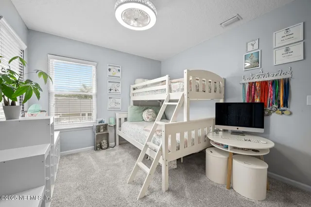 a building outdoor space with patio furniture and potted plants