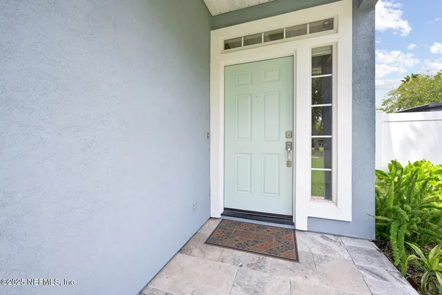 a view of a living room and hardwood floor