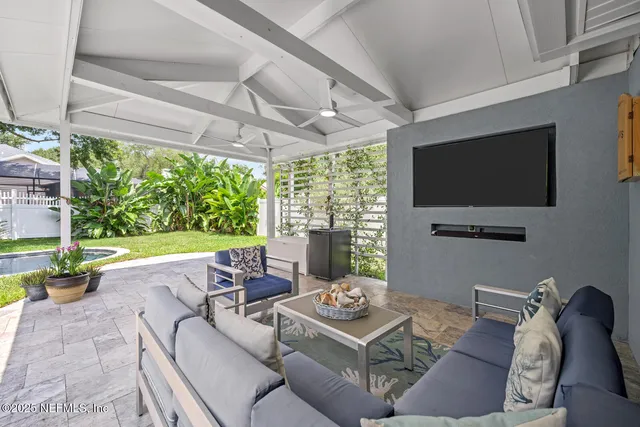 a view of a backyard with large trees