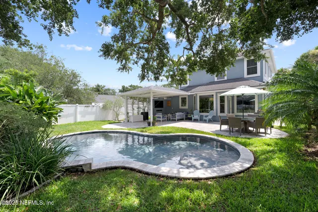 a view of a swimming pool with a patio