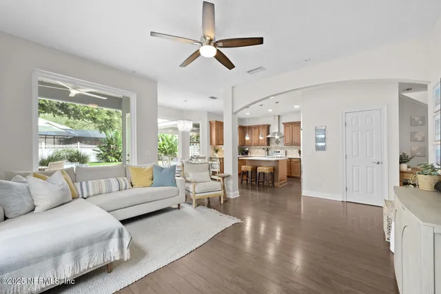 a kitchen with a table chairs refrigerator and cabinets