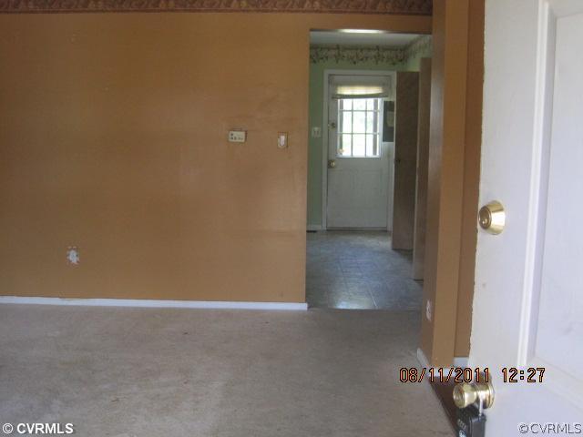 6412 Omo Road Richmond, VA 23234 - Photo 3 of 6 a view of a room with a hallway