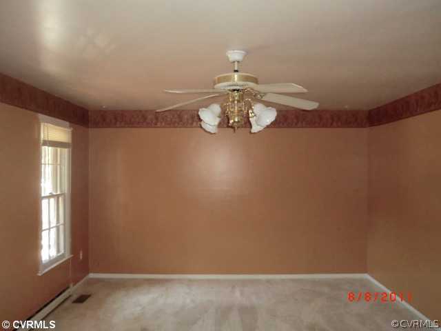 6412 Omo Road Richmond, VA 23234 - Photo 4 of 6 wooden floor in a hall with a window