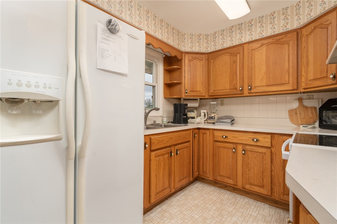 795 Spring Garden Place Dayton, OH 45431 - Photo 20 of 34 This kitchen offers functional design with ample storage and classic finishes.