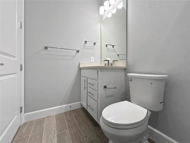 a front view of a house with a garden and plants