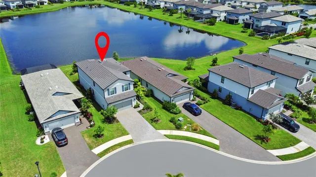 a view of a patio with a table and chairs