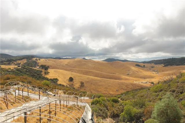 a view of mountain with ocean