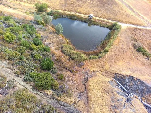 a view of a wooden door and a yard