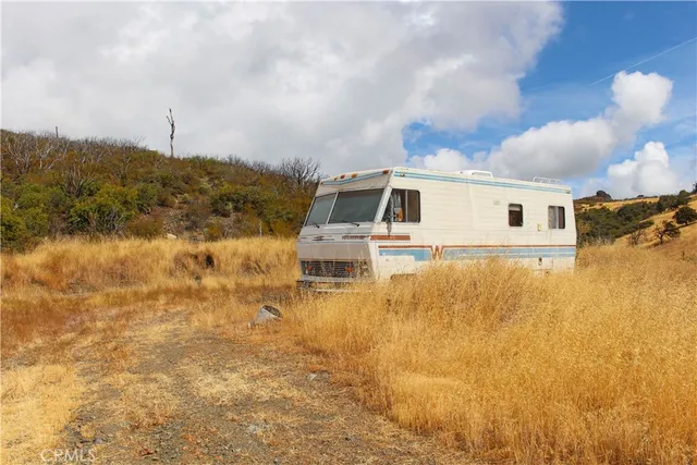 a view of the ocean with a mountain in the background
