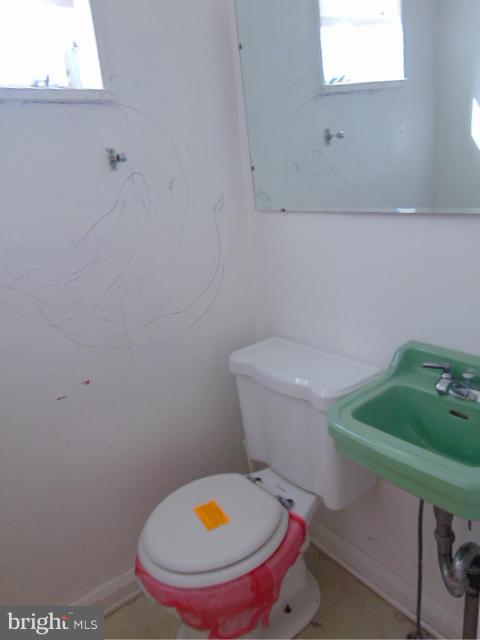 7127 Boxford Road Baltimore, MD 21215 - Photo 14 of 14 a bathroom with a toilet and a sink