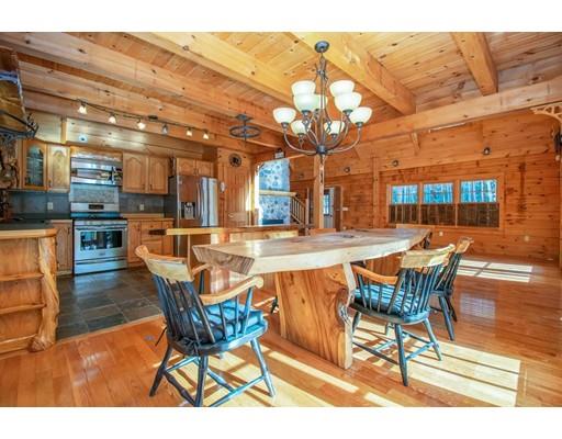 326 NW Road Westhampton, MA 01027 - Photo 15 of 42 a view of a swimming pool with a table and chairs