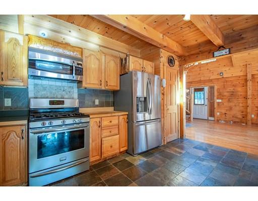 326 NW Road Westhampton, MA 01027 - Photo 17 of 42 a kitchen with stainless steel appliances granite countertop a refrigerator a stove and a microwave