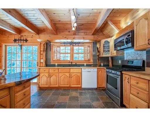 326 NW Road Westhampton, MA 01027 - Photo 19 of 42 a kitchen with stainless steel appliances granite countertop a stove a sink and a granite counter tops with white cabinets