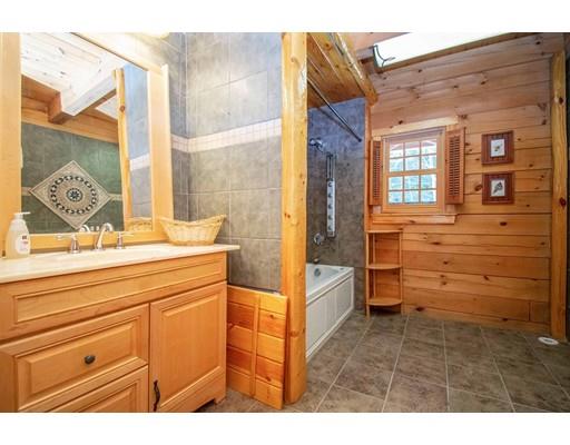 326 NW Road Westhampton, MA 01027 - Photo 25 of 42 a bathroom with a bathtub sink and mirror