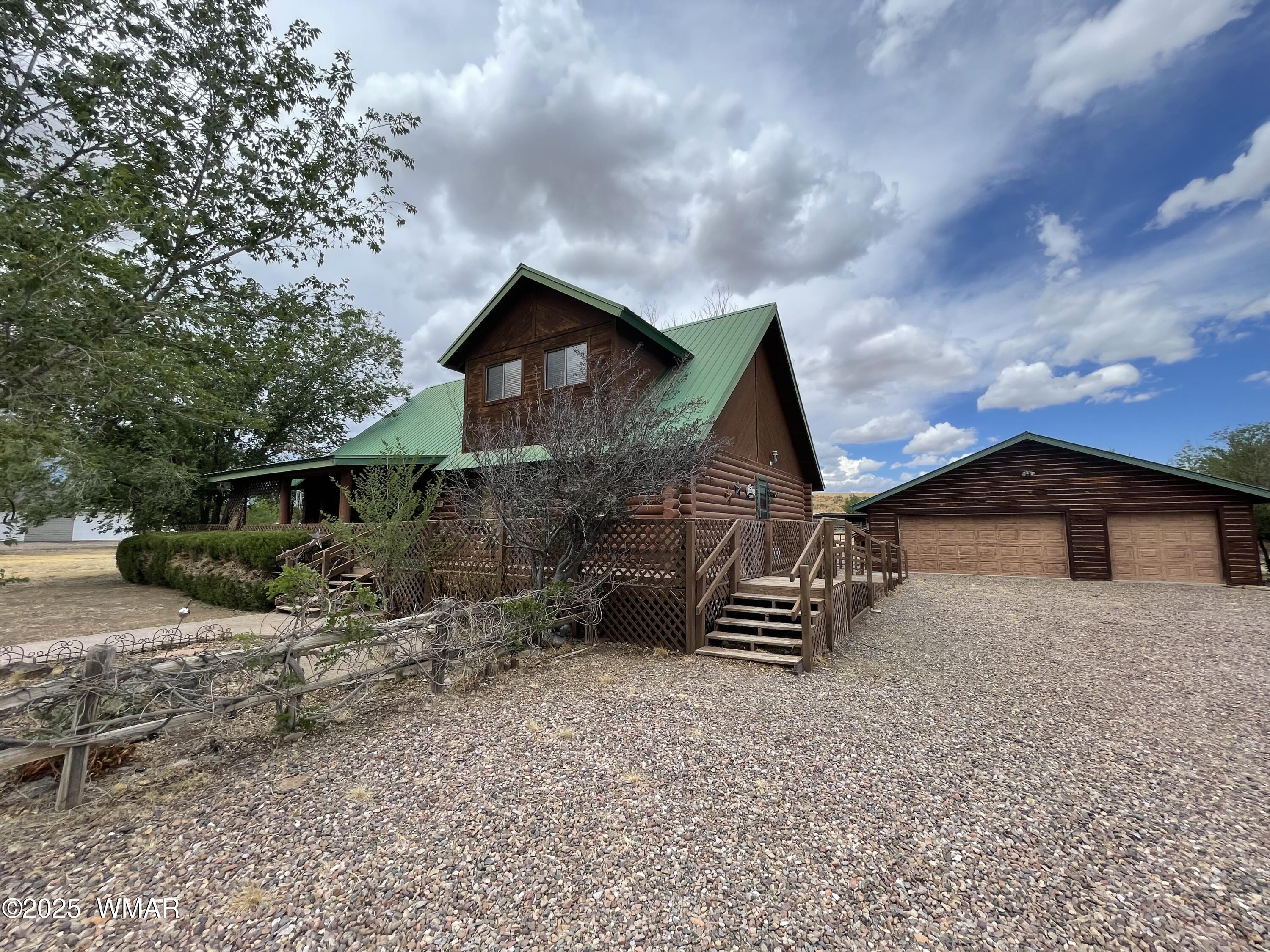183 North Becker Lake Road Springerville, AZ 85938 - Photo 30 of 41 a front view of a house with a yard