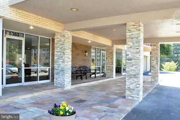 a lobby with furniture and floor to ceiling window