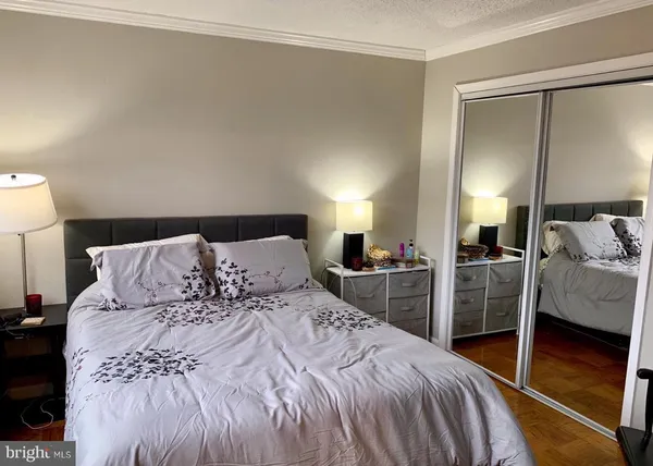 a bedroom with a bed and a walk in closet