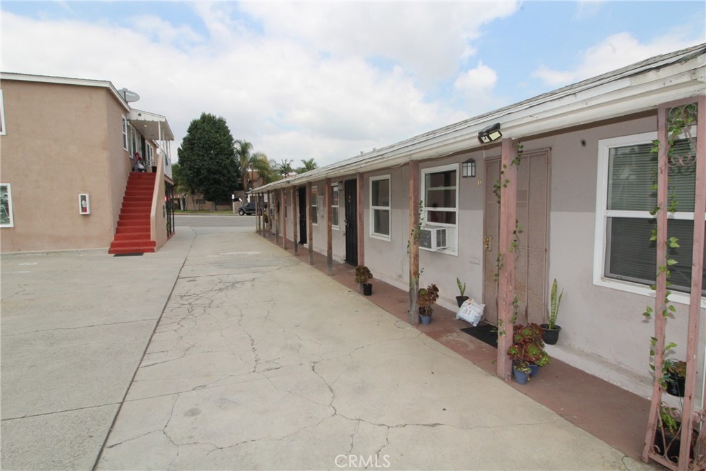 4986 Southern Avenue, Unit E South Gate, CA 90280 - Photo 2 of 9 a view of a house with a backyard