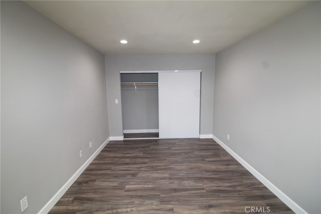 4986 Southern Avenue, Unit E South Gate, CA 90280 - Photo 9 of 9 a view of an empty room with wooden floor