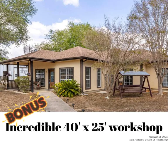 a front view of house with a garden