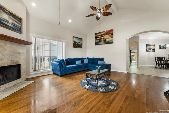 a view of a livingroom with wooden floor and cabinet