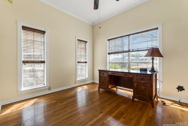 a bathroom with a granite countertop sink and a toilet