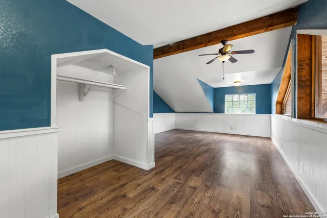 a view of an empty room with storage