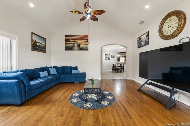 a living room with furniture and a fireplace