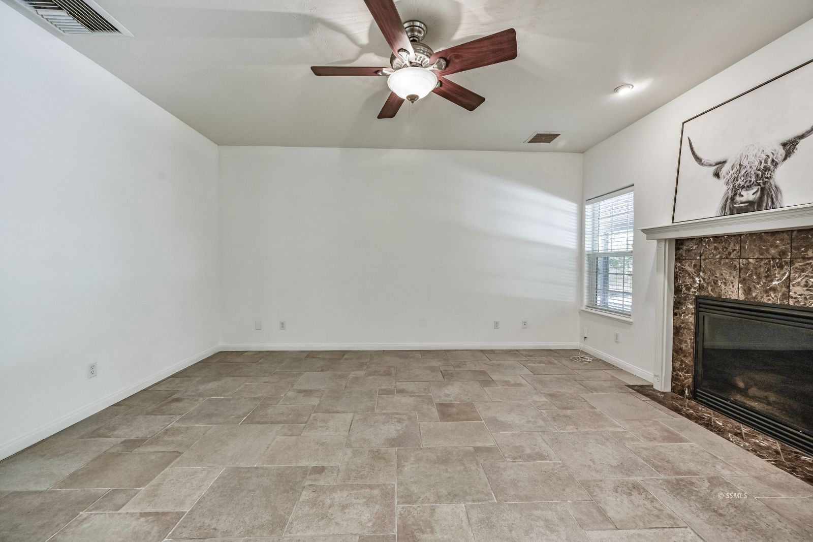 425 Acacia Street Ridgecrest, CA 93555 - Photo 40 of 49 an empty room with windows and fireplace