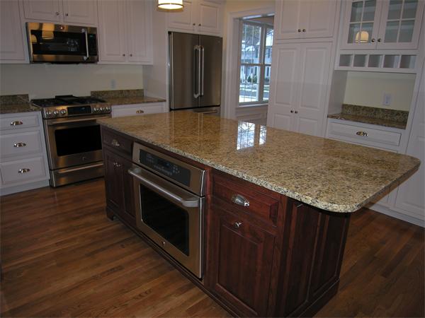 73 Berkshire Road Needham, MA 02492 - Photo 11 of 28 a kitchen with stainless steel appliances granite countertop a stove a sink and a microwave