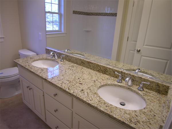 73 Berkshire Road Needham, MA 02492 - Photo 21 of 28 a bathroom with a granite countertop double sink and a mirror