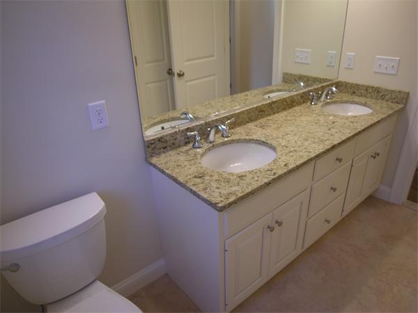 73 Berkshire Road Needham, MA 02492 - Photo 23 of 28 a bathroom with a granite countertop sink and a mirror