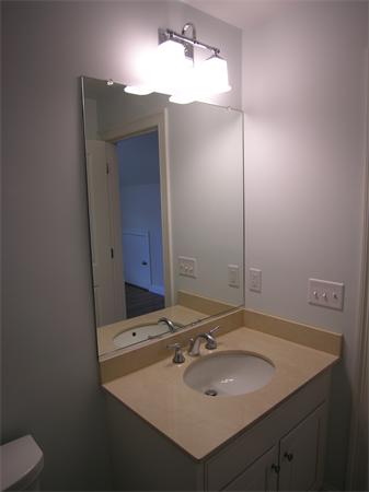 73 Berkshire Road Needham, MA 02492 - Photo 28 of 28 a bathroom with a sink and a mirror