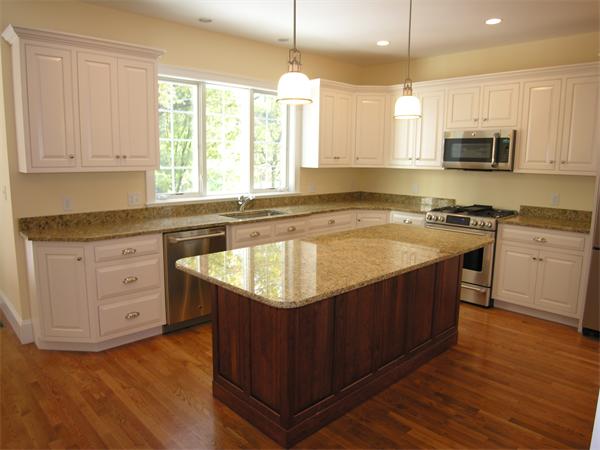 73 Berkshire Road Needham, MA 02492 - Photo 6 of 28 a kitchen with stainless steel appliances granite countertop a sink a stove and cabinets