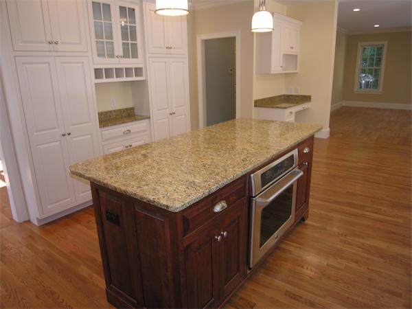 73 Berkshire Road Needham, MA 02492 - Photo 9 of 28 a kitchen with granite countertop a stove and a wooden floors