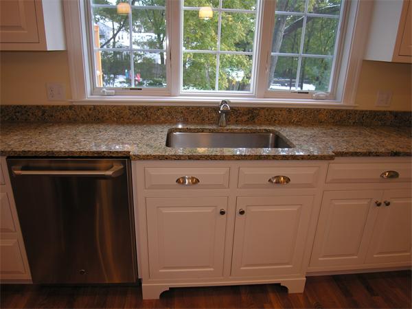 73 Berkshire Road Needham, MA 02492 - Photo 10 of 28 a kitchen with granite countertop a sink window and cabinets