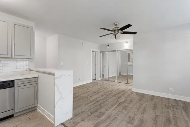 a view of a kitchen with a sink and dishwasher